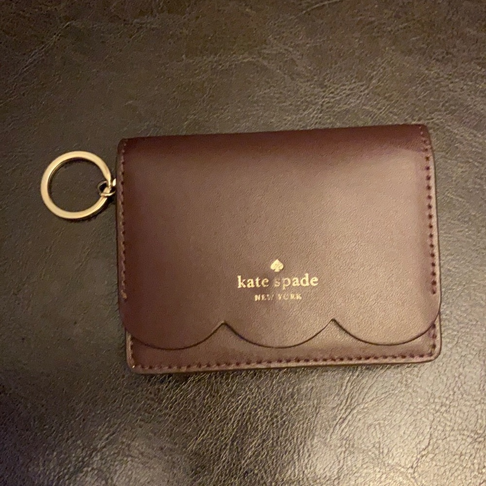 Kate Spade key chain card holder wallet is used but in very good condition.